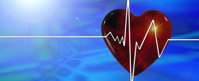 Red Heart with heartbeat path on a blue background