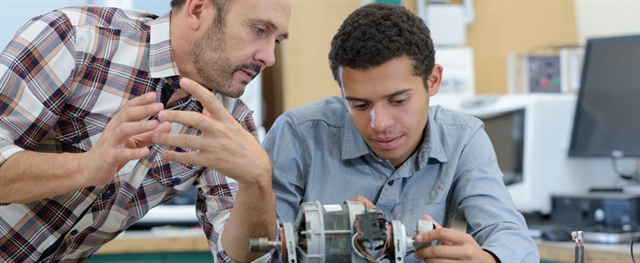 Mechatronics program: teacher and student working together